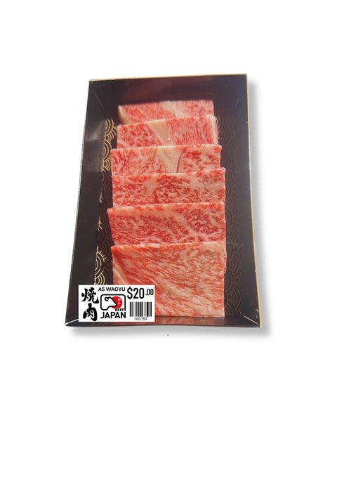 Packaged sliced meat with a brand label on a white background