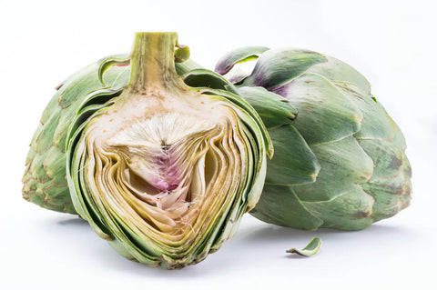 Artichoke cut in half on a white background