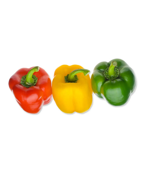 Three bell peppers side by side on a white background, red on the left, yellow in the middle, and green on the right.