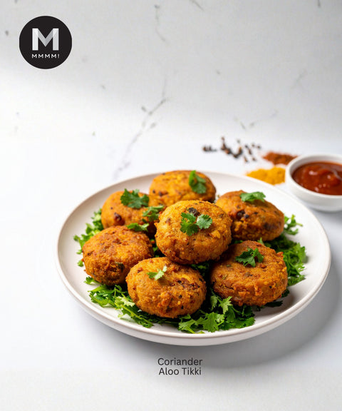 Platter of Coriander Aloo Tikki with a side of chutney on a white background