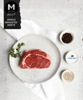 Cape Grim grass-fed Angus ribeye steak plated and ready to cook