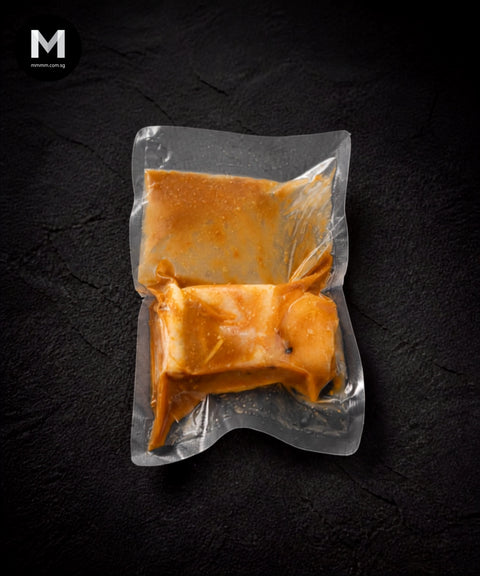 Spanish Swordfish fillet marinated in miso blend, close angle showing thick miso marinade coating
