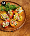 Stuffed mixed capsicum on a wood platter