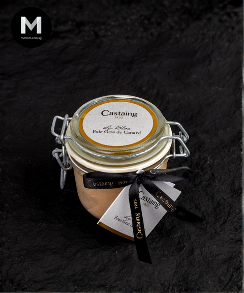 Jar of Castaing foie gras on a dark background