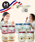 Jars of 0% Fat Free yogurt with branding and two women enjoying the product against a white background.