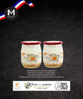 Two jars of apricot yogurt with a dark background and MMMMI logo.