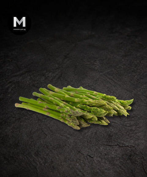 Thai baby/pencil asparagus spears on a black background