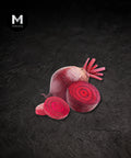 Organic beetroot, whole and sliced showing deep red flesh, on a black background