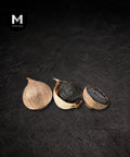 Black garlic bulbs close-up on a black background