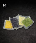 Sealed cauliflower rice pouches on a black background