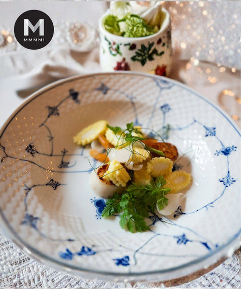 Chervil garnishing a plated scallop dish