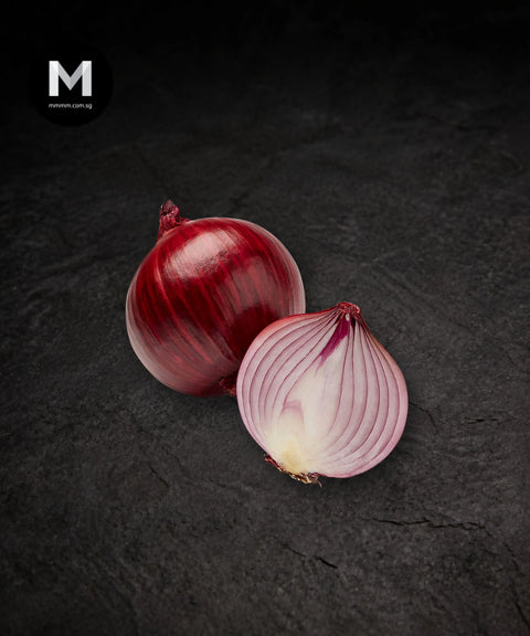 Spanish Red Onion, whole and halved, on black background