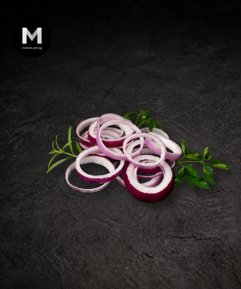 Sliced Spanish Red Onion rings on black background