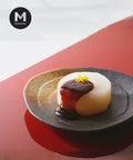 Cooked White Radish (Daikon) dish with red miso glaze and yuzu zest