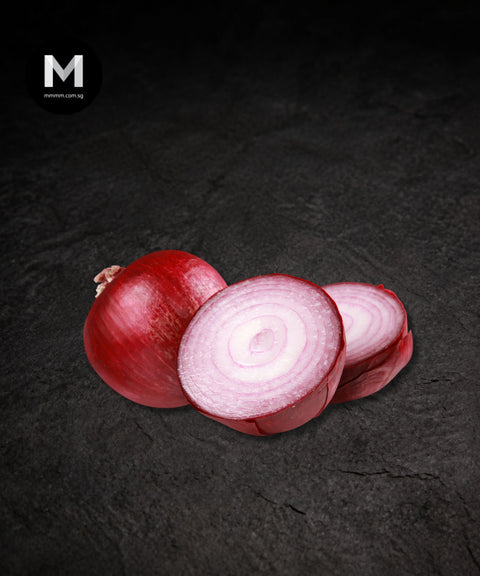 Single red onion on a black background