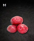 Red skin potatoes on a black background