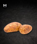 Russet potato on a black background