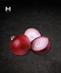 Single Spanish red onion on a black background