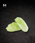 Sliced wawa cabbage on a black background