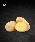 White skin potatoes on a black background